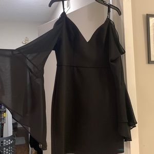 Little black dress with sheer off the shoulder sleeves